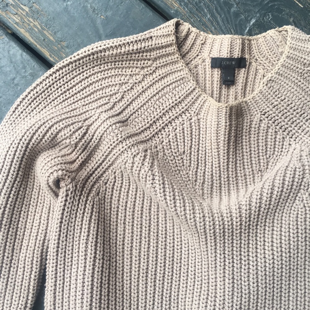 Crew neck sweater.
